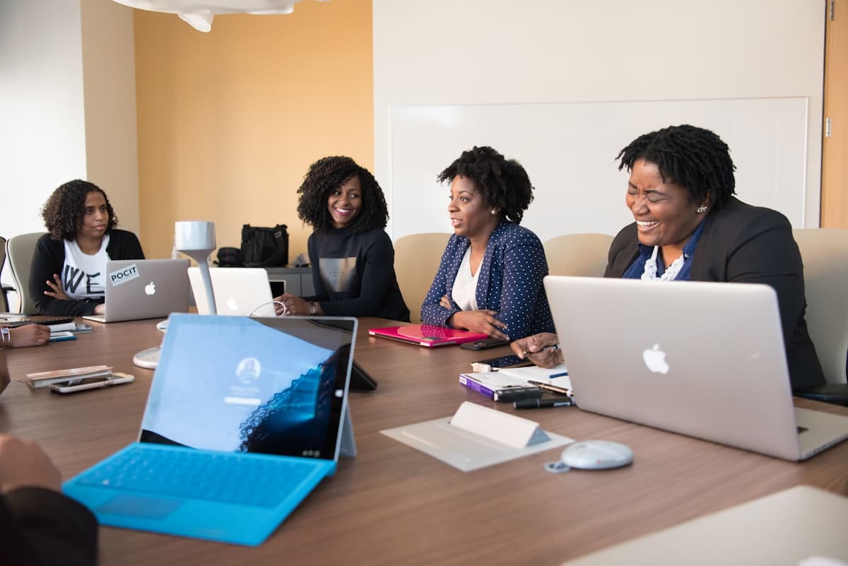 A candid, natural meeting around a boardroom table, illustrative of a collaborative planning discussion